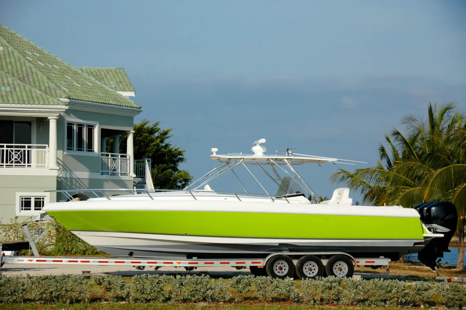 Boat transport service showing a powerboat securely hauled on a trailer for professional boat shipping and delivery.
